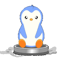 a blue and white penguin is sitting on top of a circular object