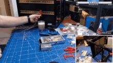 a screenshot of a printednest video shows a man working