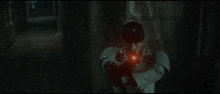 a red light is shining through a red curtain in a dark room