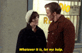 a man and a woman are standing in front of a store with a sign that says " whatever it is let me help "