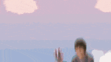 a man is flying in a hot air balloon in front of a rainbow