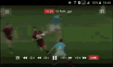 a soccer game is being played on a cell phone screen