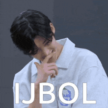 a man in a white shirt is covering his mouth with his hand and the word ijbol is on the bottom
