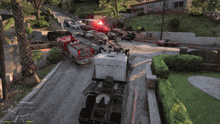 a video game scene shows a fire truck and a semi truck driving down a street