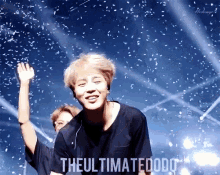 a man is standing on a stage with confetti falling around him and the words " the ultimate dodo " on the bottom