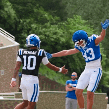 a football player in a blue jersey with the number 43 on it