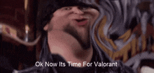 a man is making a funny face with the words ok now its time for valorant written below him