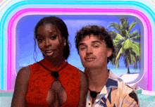 a man and a woman are posing for a picture in front of a window with a palm tree in the background