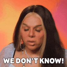 a woman says " we don 't know " in front of a pink background