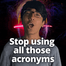 a man wearing glasses stands in front of a neon sign that says stop using all those acronyms
