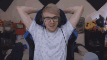 a man wearing headphones has a tattoo on his arm that says hk