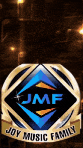 a logo for the joy music family with a gold ribbon around it