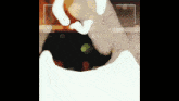 a blurred image of a person 's hand with a white circle in the middle