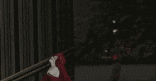 a man in a red coat is holding a chainsaw and a flame is coming out of it