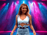 a woman in a crop top and shorts is dancing on a stage with a pollo ai logo in the background