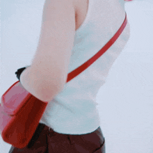 a woman with pink hair is wearing a white tank top