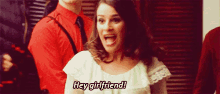 a woman in a white dress is screaming and says hey girlfriend
