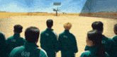 a group of people wearing green jackets with numbers on the back