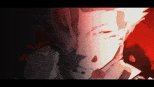 a close up of a person 's face in a dark room with a red background .
