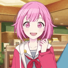 a girl with pink hair and a smiley face on her jacket is smiling