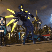 a blue robot with yellow wings is standing next to a girl in a blue dress .