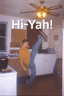 a man is doing a split in a kitchen and the caption says hi-yah!