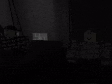 a dark room with a projector screen and a smiley face on the wall .