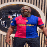 a man wearing a red and blue jersey with the word stack on the front