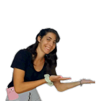 a woman is making a funny face and giving a thumbs up .