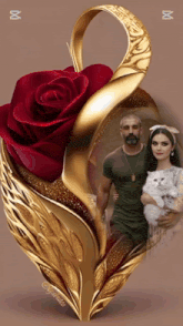 a picture of a man and a woman holding a cat in a gold frame