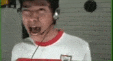 a man wearing a headset is making a funny face while talking on a video call .