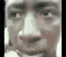 a close up of a man 's face in a pixel art style