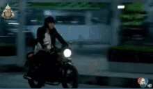 a man is riding a motorcycle with the number 7 on the bottom left