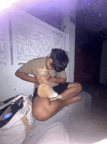 a person sitting on a staircase with a cat and the number 211 on the wall