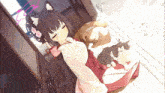 a girl with cat ears is laying on the floor with two cats on her lap