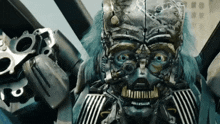 a close up of a robot 's face with a clock face on it