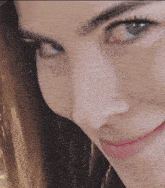 a close up of a woman 's face with a pink lip