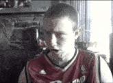 a man wearing a basketball jersey that says nba on it