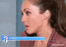 a woman 's face is shown in front of a dimes banner