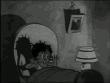 a black and white cartoon of a bed with a lamp and a picture on the wall above it .
