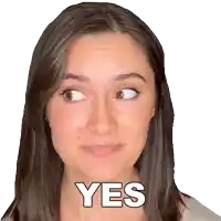 a woman is making a funny face and the word yes is visible on her face