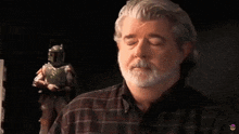 a man says that is complete bullshit in front of a boba fett figure