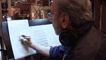 Writing On A Music Sheet Neil Diamond GIF - Writing On A Music Sheet Neil Diamond Melody Road Song GIFs
