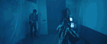 a man is playing a guitar while a woman is dancing