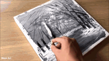 a person is painting a black and white painting with wow art written on the bottom