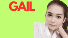 a woman 's face is against a green background with the word gail in red