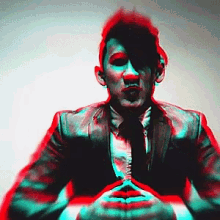 a man in a suit and tie is making a face with his mouth open