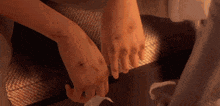 a close up of a person 's wrists with a few stitches on them