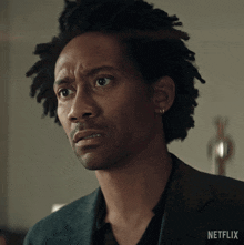 a close up of a man 's face with the word netflix on the bottom right