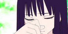 a close up of a girl 's face with a tear running down her cheek